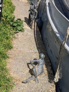 Figures beside the canal